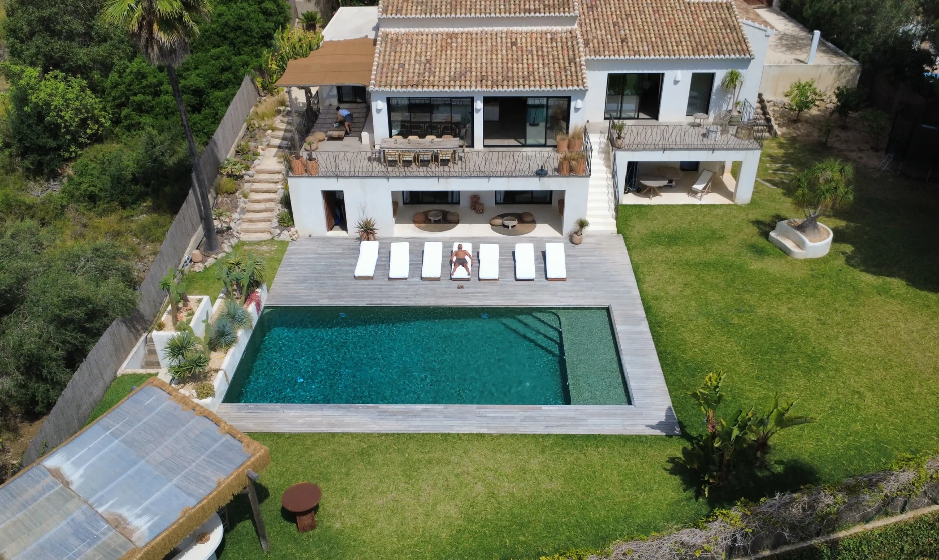 Aerial view of a Mediterranean property and pool, from the Creative Studio Agency website